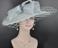 Sinamay Disc Fascinator Hat with  Jumbo Bows and netting Powder Blue